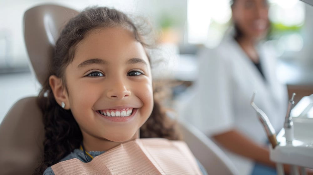 A smiling young patient in the dental chair